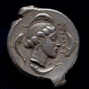 Image of Tetradrachm (coin); obverse: Head of Nymph Arethusa; reverse: Charioteer Guiding Biga with Nike Preparing to Crown Him